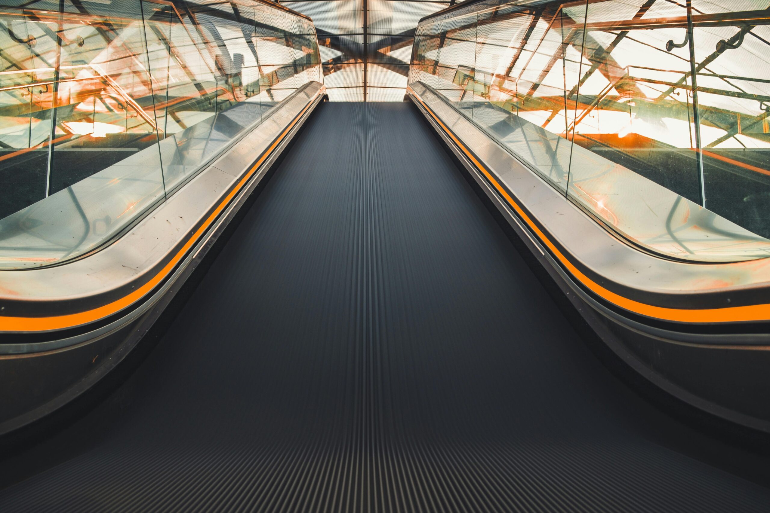 Dynamic low angle view of an escalator in a Hamburg transport hub, showcasing modern design and perspective.
